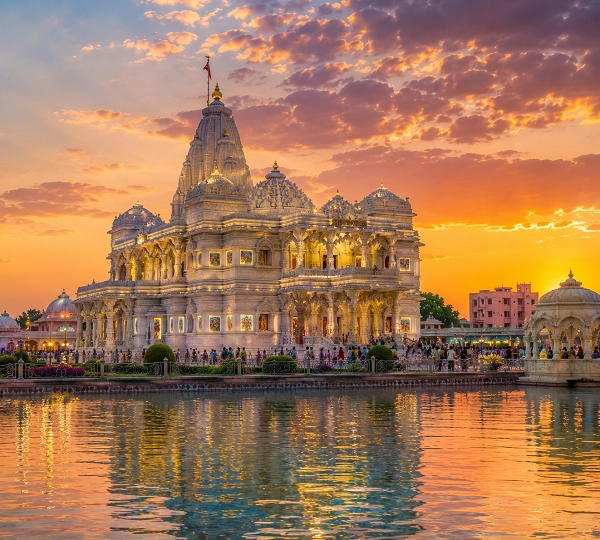 Hindu temple at sunset reflected in water