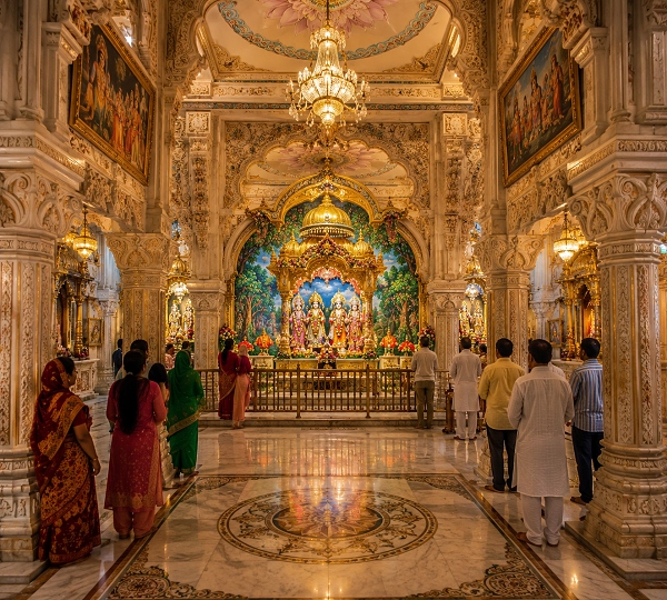 Hindu temple interior with worshippers