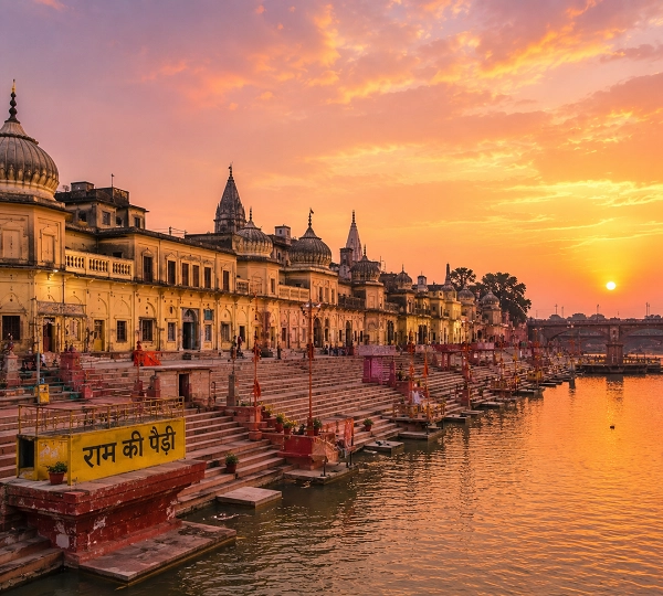 Serene ghat at sunrise with temples
