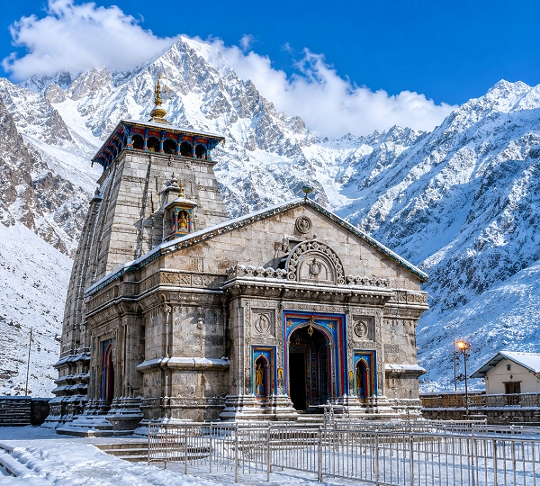 Snowy temple at mountain's edge